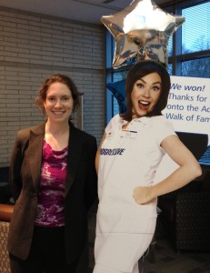 Clarissa posing with a cardboard cutout of Flo from the Progressive commercials.